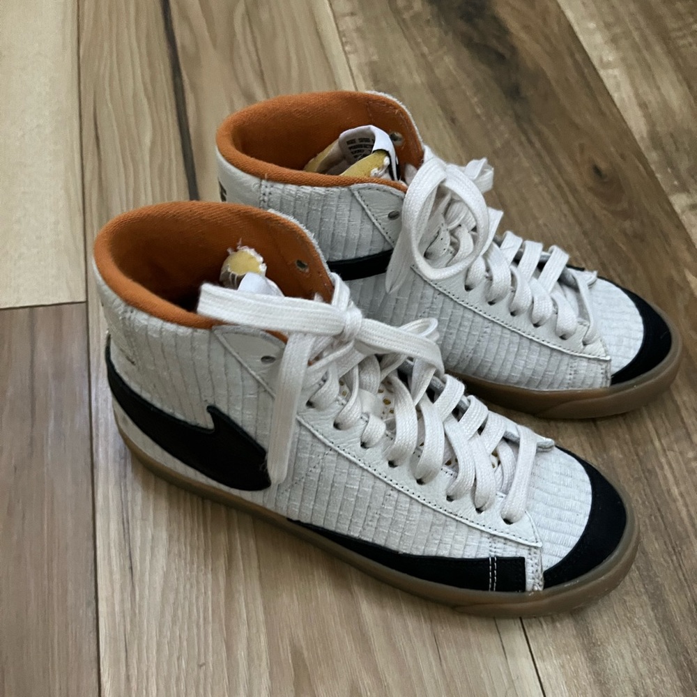 Women’s high top Nike sneakers.